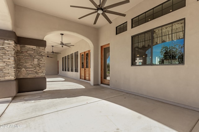 view of patio featuring ceiling fan