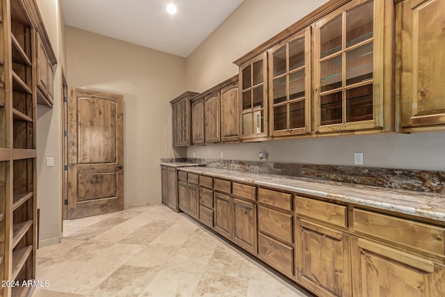 kitchen featuring light stone counters