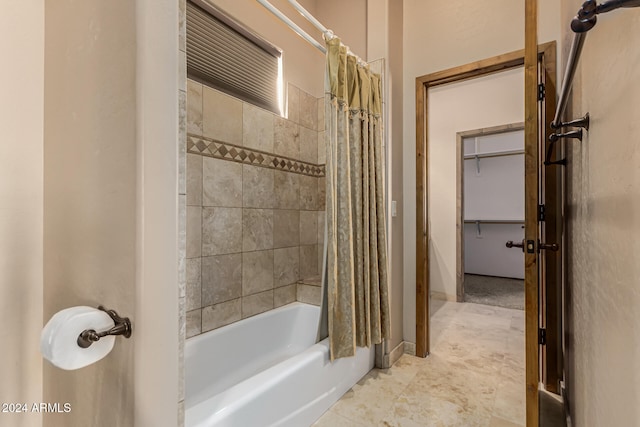 bathroom with shower / tub combo with curtain