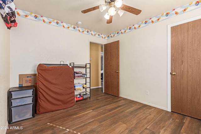 bedroom with ceiling fan and dark hardwood / wood-style flooring