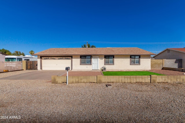 single story home with a garage