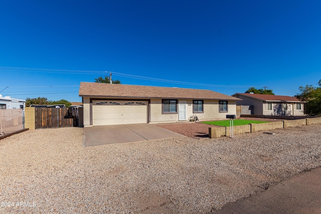 ranch-style home featuring a garage