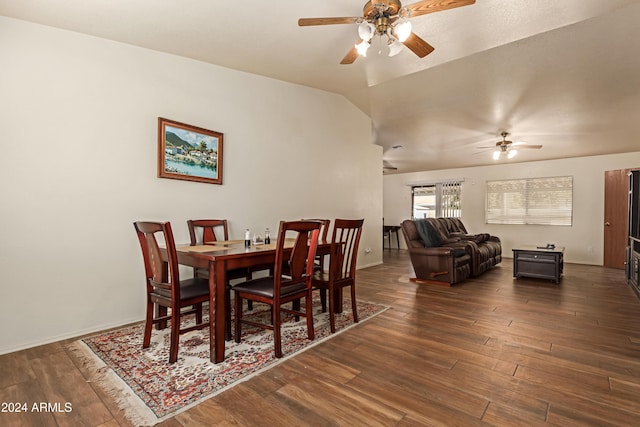 dining area featuring dark hardwood / wood-style flooring, ceiling fan, and lofted ceiling