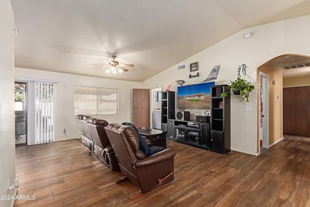 living room featuring dark hardwood / wood-style flooring, vaulted ceiling, and ceiling fan