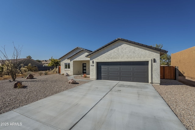 ranch-style home featuring a garage