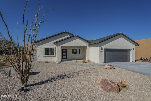 ranch-style house featuring a garage