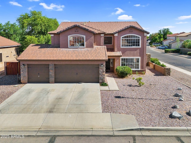 941 E Stirrup Ln, San Tan Valley, AZ 85143 - view of front of home featuring driveway, stucco siding, stone siding, and a garage