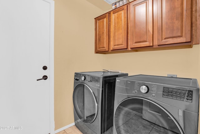941 E Stirrup Ln, San Tan Valley, AZ 85143 - laundry area with washing machine and clothes dryer, cabinet space, and light tile patterned flooring