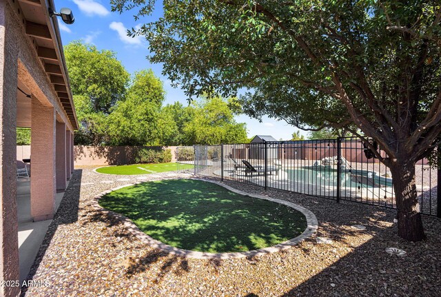 941 E Stirrup Ln, San Tan Valley, AZ 85143 - fenced backyard featuring a patio area