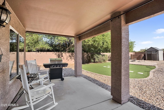 941 E Stirrup Ln, San Tan Valley, AZ 85143 - fenced backyard with a putting green, a patio area, a storage unit, and grilling area