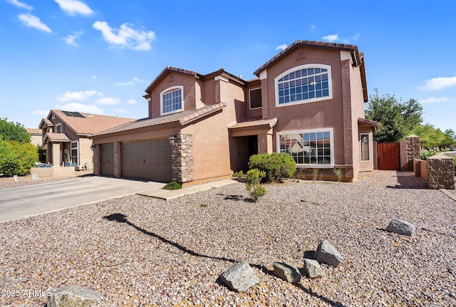 941 E Stirrup Ln, San Tan Valley, AZ 85143 - traditional-style house with driveway, stucco siding, a gate, an attached garage, and a tiled roof
