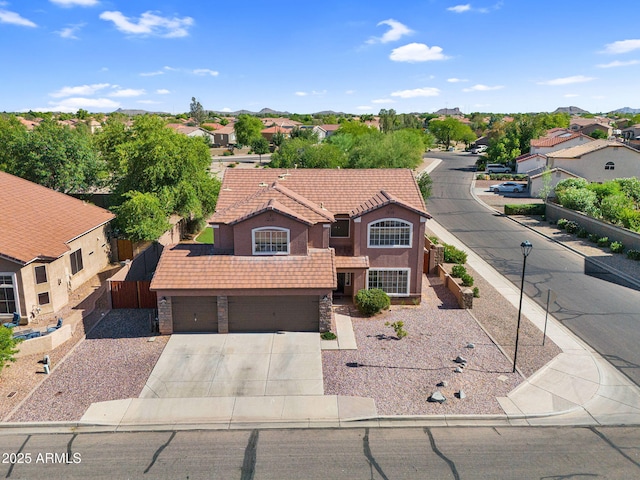 941 E Stirrup Ln, San Tan Valley, AZ 85143 - view of front of property with a residential view, an attached garage, concrete driveway, and stucco siding