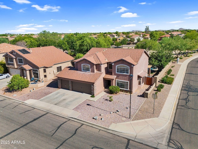 941 E Stirrup Ln, San Tan Valley, AZ 85143 - view of front of home with a tile roof, driveway, stucco siding, and a residential view