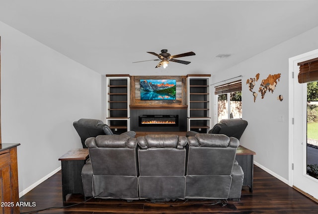 941 E Stirrup Ln, San Tan Valley, AZ 85143 - living area featuring a ceiling fan, a glass covered fireplace, and wood finished floors