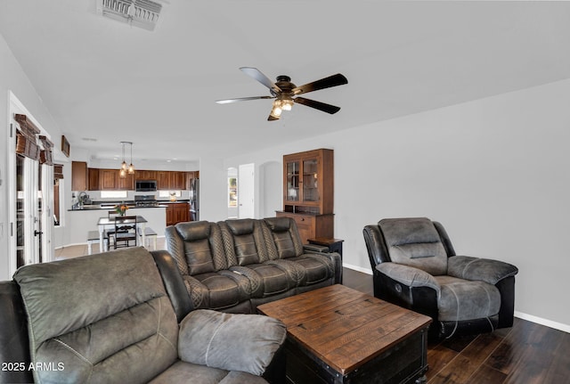 941 E Stirrup Ln, San Tan Valley, AZ 85143 - living area with a ceiling fan and dark wood-style floors