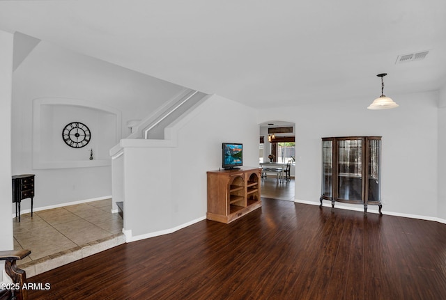 941 E Stirrup Ln, San Tan Valley, AZ 85143 - living room with arched walkways and wood finished floors