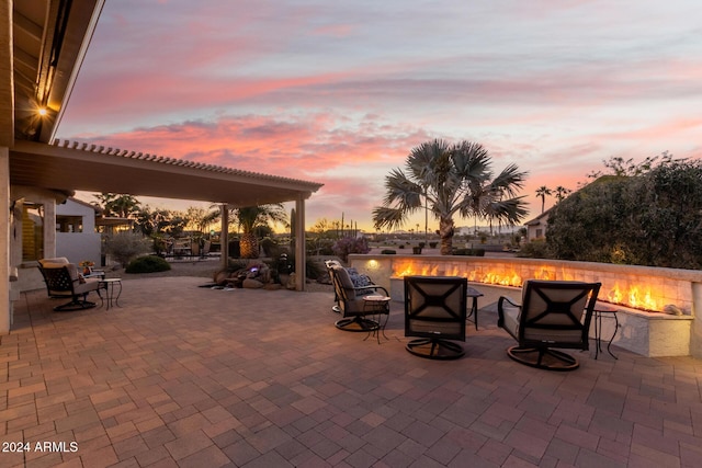 patio terrace at dusk with an outdoor fire pit