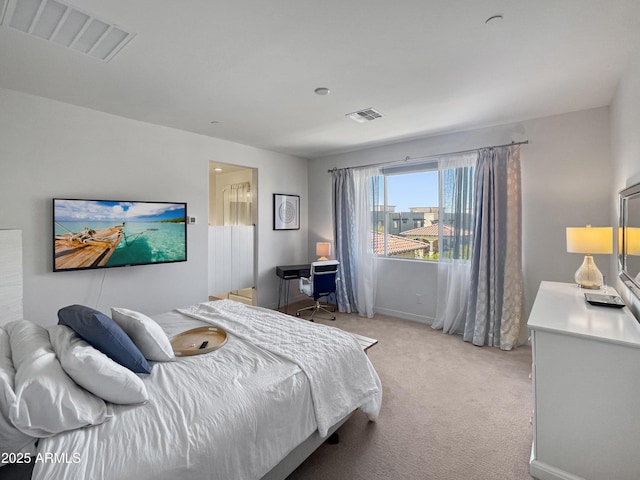 bedroom featuring light colored carpet, visible vents, and baseboards
