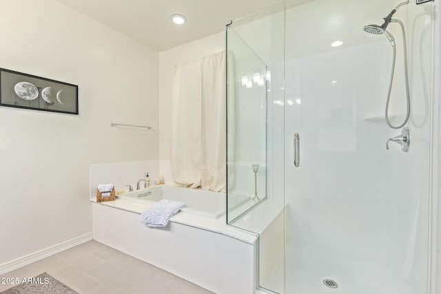 bathroom with a garden tub, recessed lighting, a stall shower, and baseboards