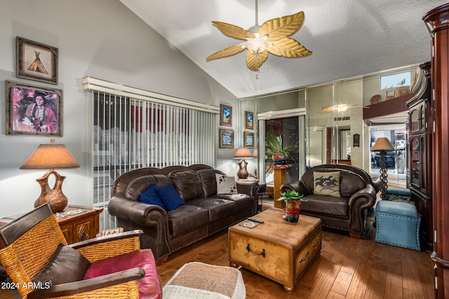 living room featuring a textured ceiling, ceiling fan, dark wood-type flooring, and high vaulted ceiling