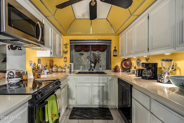 kitchen with white cabinetry, sink, ceiling fan, light tile patterned floors, and black appliances