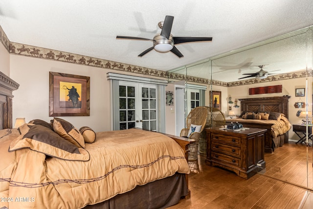 bedroom featuring ceiling fan, a textured ceiling, and hardwood / wood-style flooring