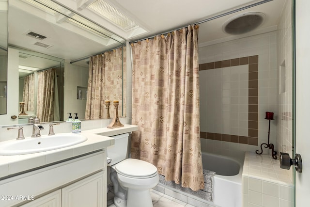 full bathroom featuring tile patterned flooring, vanity, shower / tub combo, and toilet