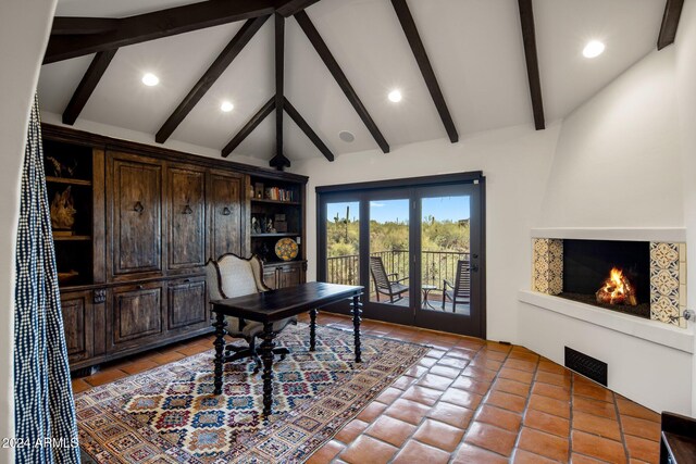 office with vaulted ceiling with beams, a large fireplace, and french doors