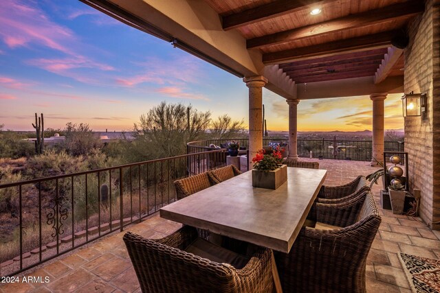 view of patio terrace at dusk