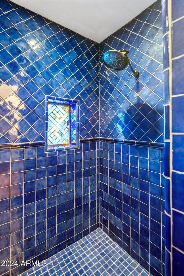 bathroom with tiled shower