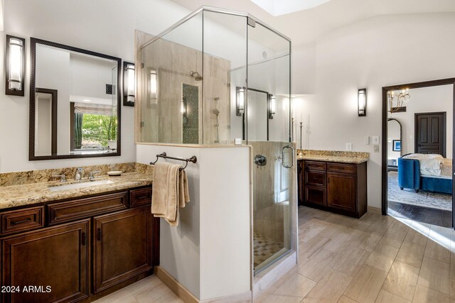 bathroom with vanity and an enclosed shower