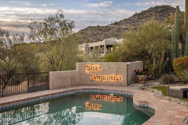 view of swimming pool featuring a mountain view