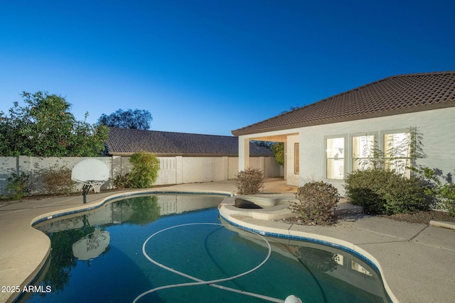 view of pool featuring a patio area, a fenced backyard, and a fenced in pool