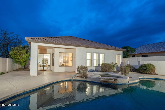 view of pool featuring an in ground hot tub, a patio, a fenced backyard, and a fenced in pool