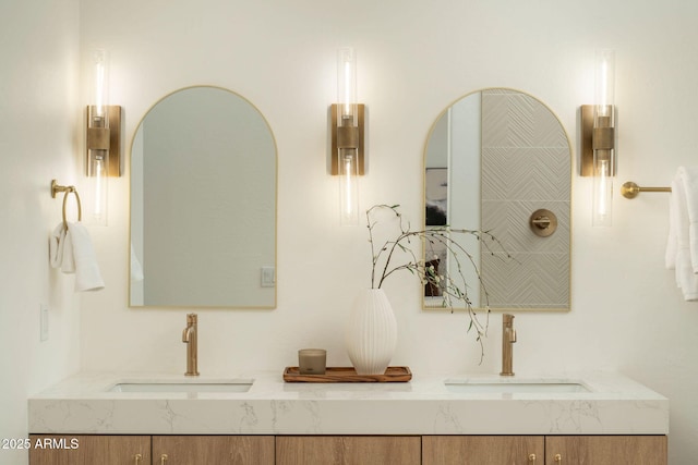 details featuring double vanity and a sink