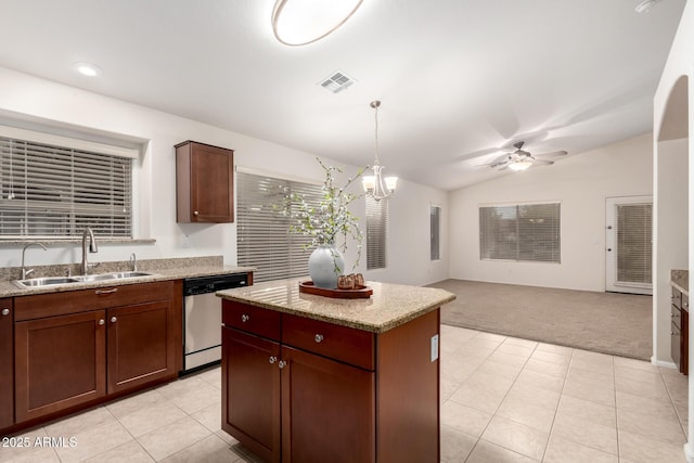 kitchen with visible vents, a sink, vaulted ceiling, light carpet, and stainless steel dishwasher