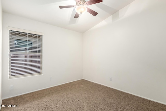 spare room featuring baseboards, carpet, and ceiling fan