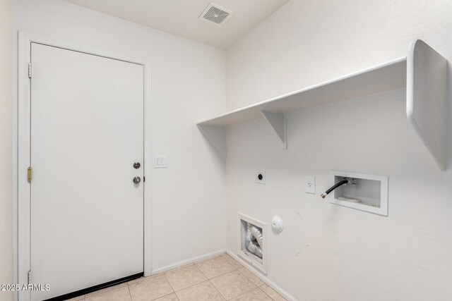 laundry room featuring hookup for a washing machine, light tile patterned floors, gas dryer hookup, laundry area, and electric dryer hookup