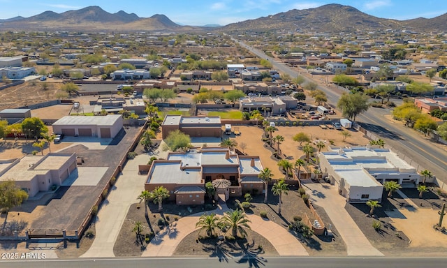 birds eye view of property featuring a mountain view