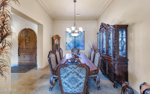 dining space with a chandelier