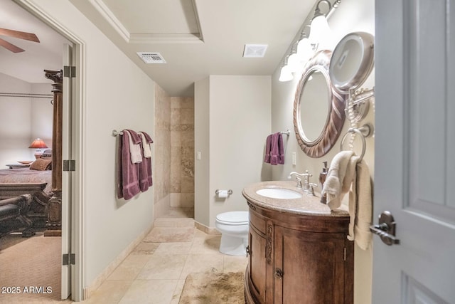 bathroom featuring toilet, vanity, and tile patterned flooring