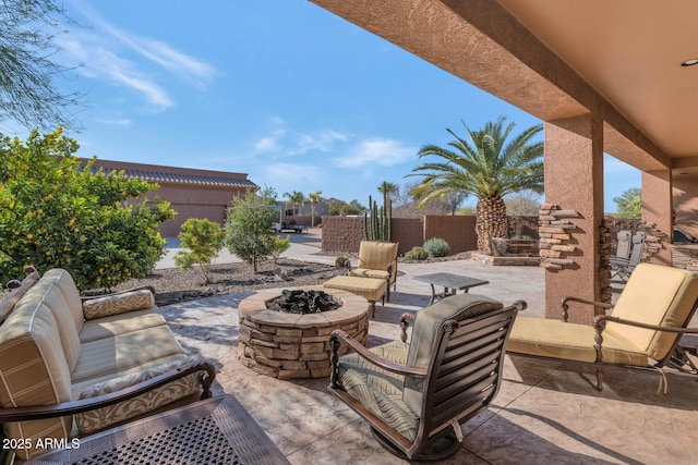 view of patio / terrace featuring an outdoor living space with a fire pit