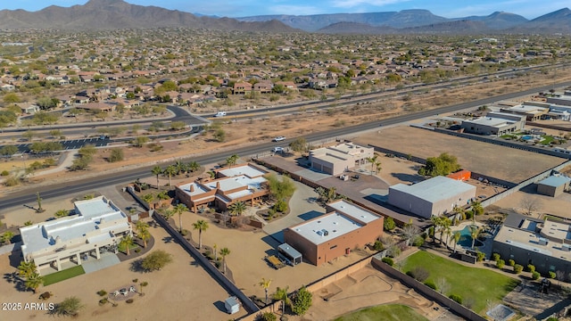 birds eye view of property with a mountain view