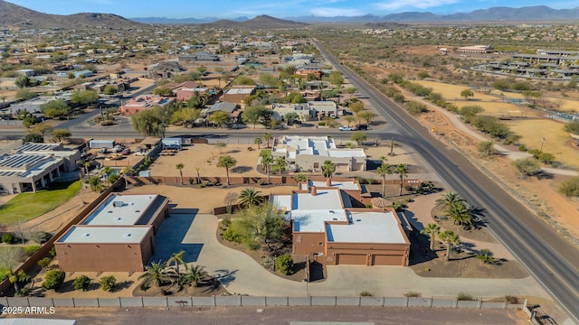 birds eye view of property featuring a mountain view