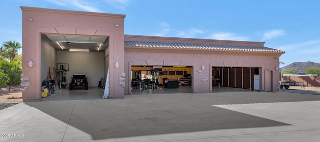 exterior space with a mountain view and a garage