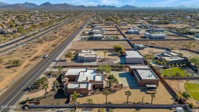 birds eye view of property featuring a mountain view