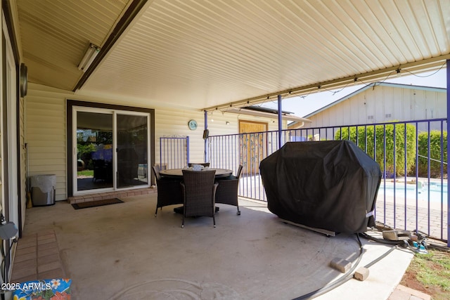 15212 N 37th Ave, Phoenix, AZ 85053 - view of patio / terrace featuring outdoor dining space, grilling area, and an outdoor pool