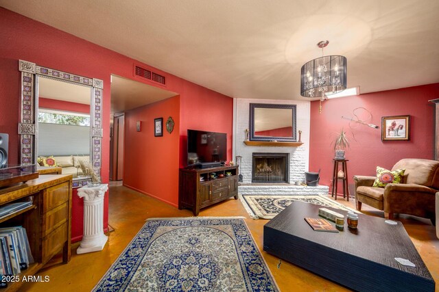 15212 N 37th Ave, Phoenix, AZ 85053 - living room featuring a brick fireplace, a chandelier, and visible vents