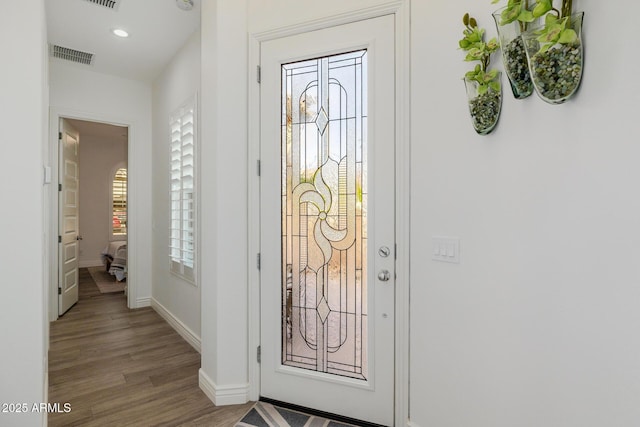 entryway with plenty of natural light and light wood-type flooring