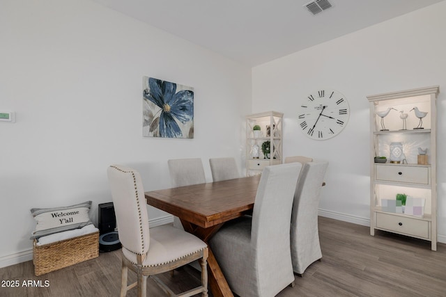 dining area featuring wood-type flooring